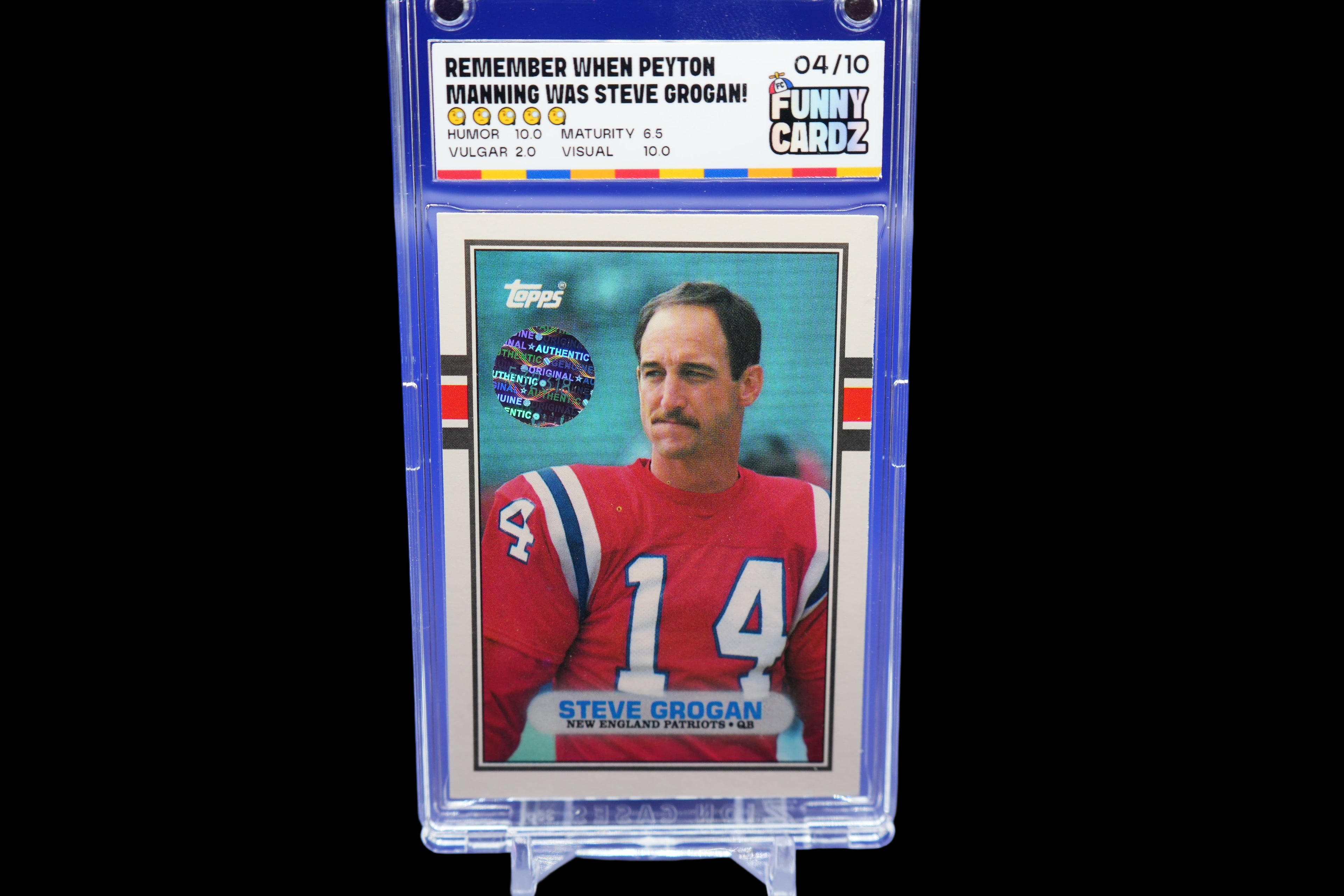 Trading card of Steve Grogan in a protective holder with a blue background