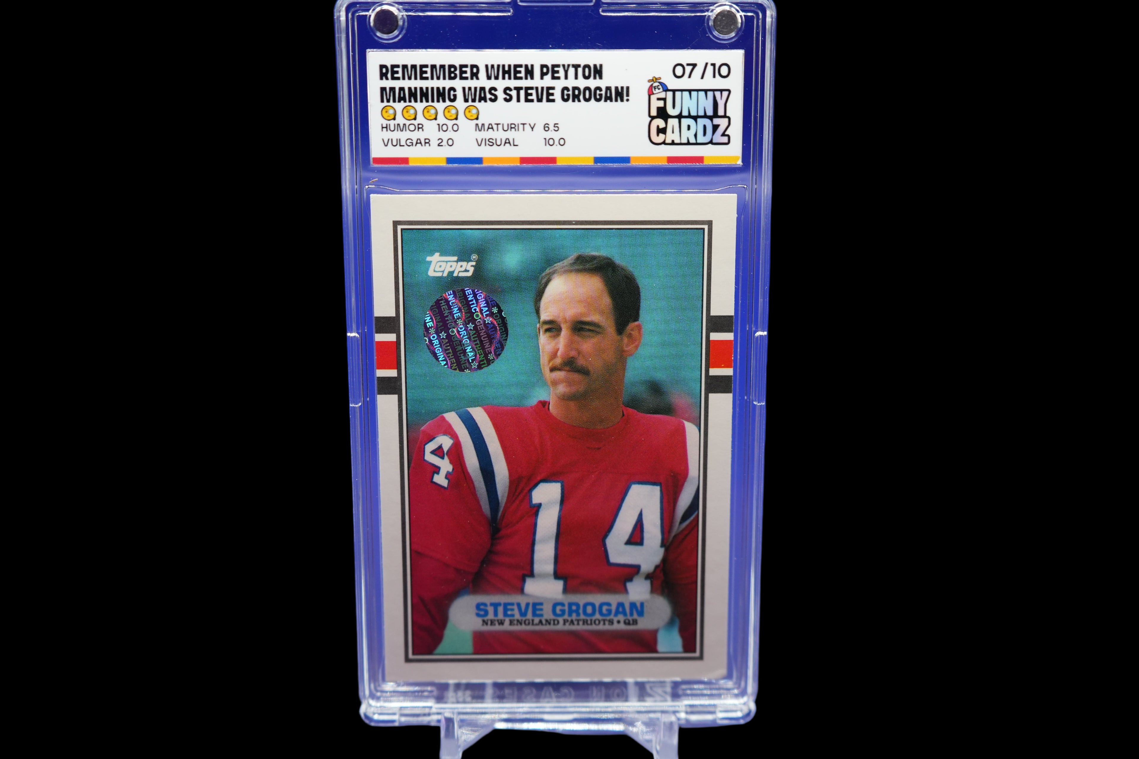 Trading card of Steve Grogan in a protective case on a blue background