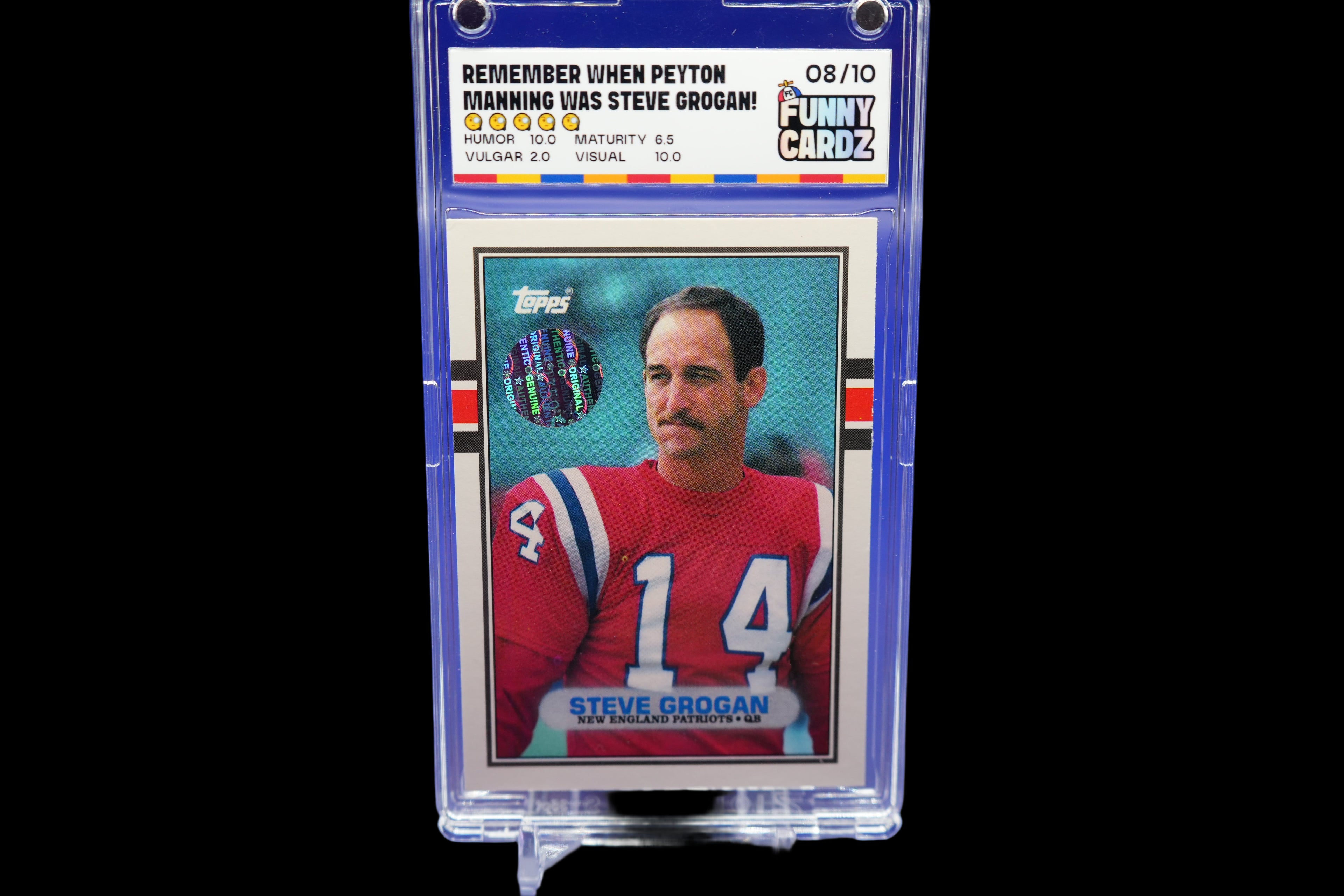 Collectible sports trading card of Steve Grogan in a display case with a blue background