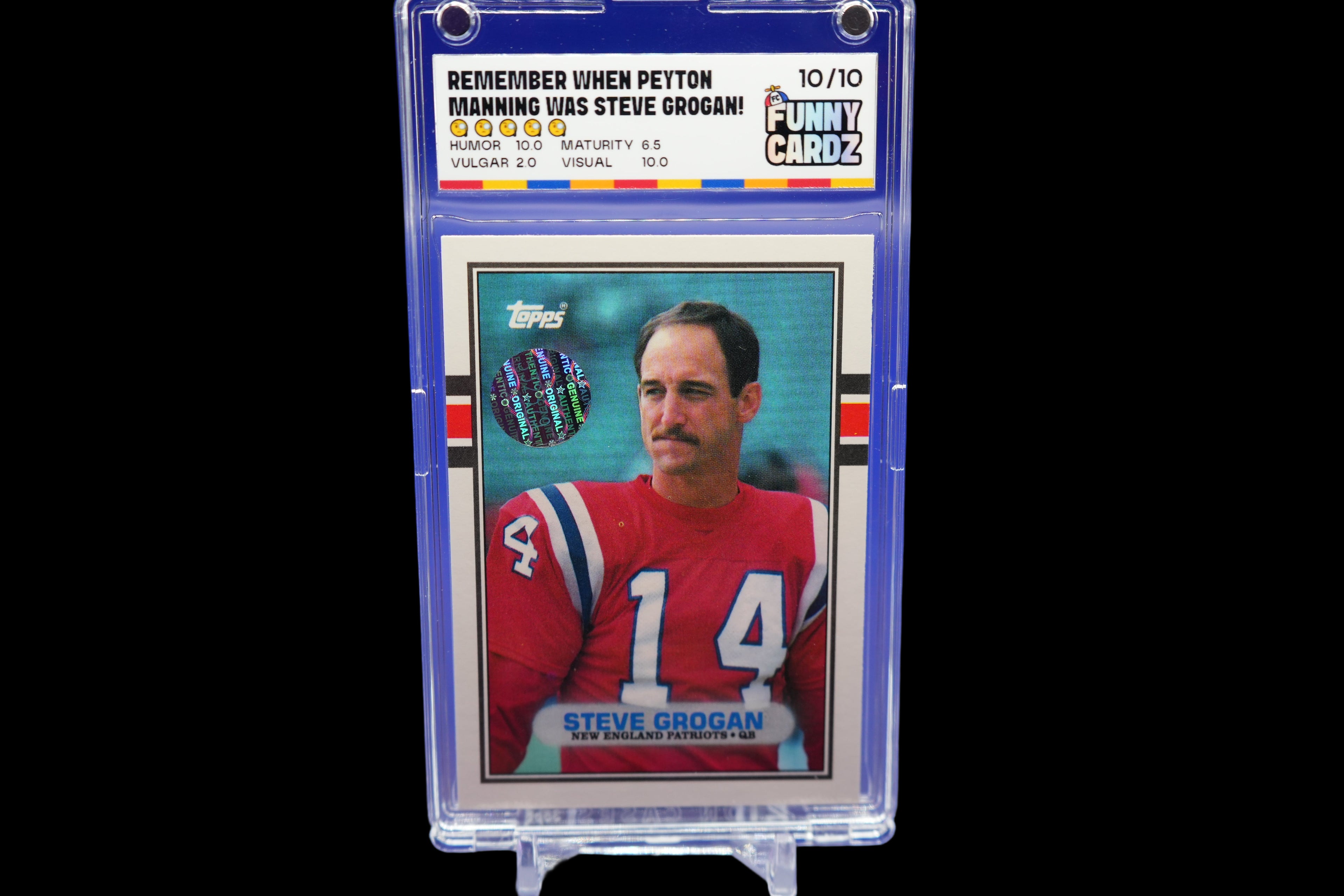 Trading card of Steve Grogan in a protective case on a blue background