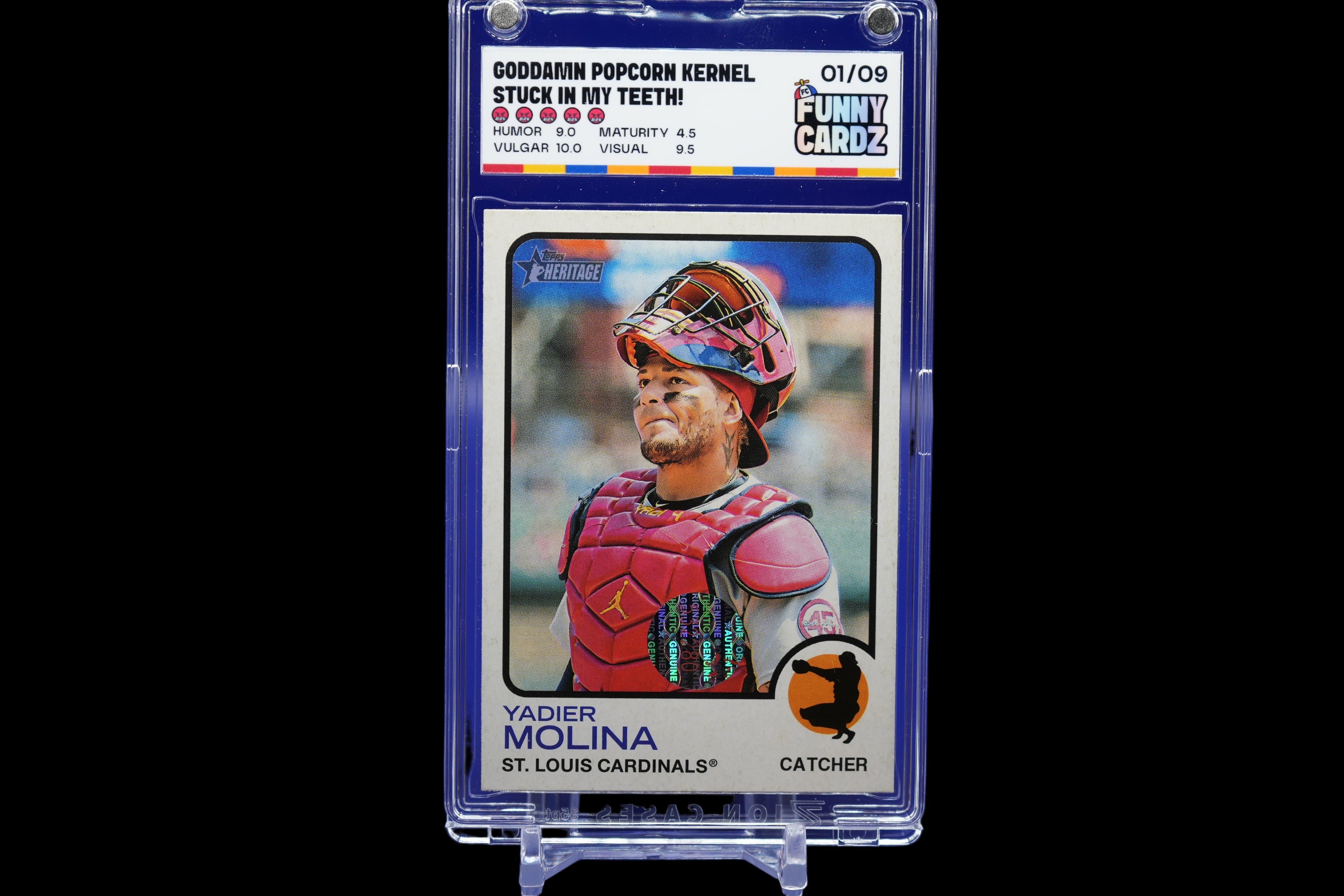Trading card of a baseball player in a protective case on a blue background