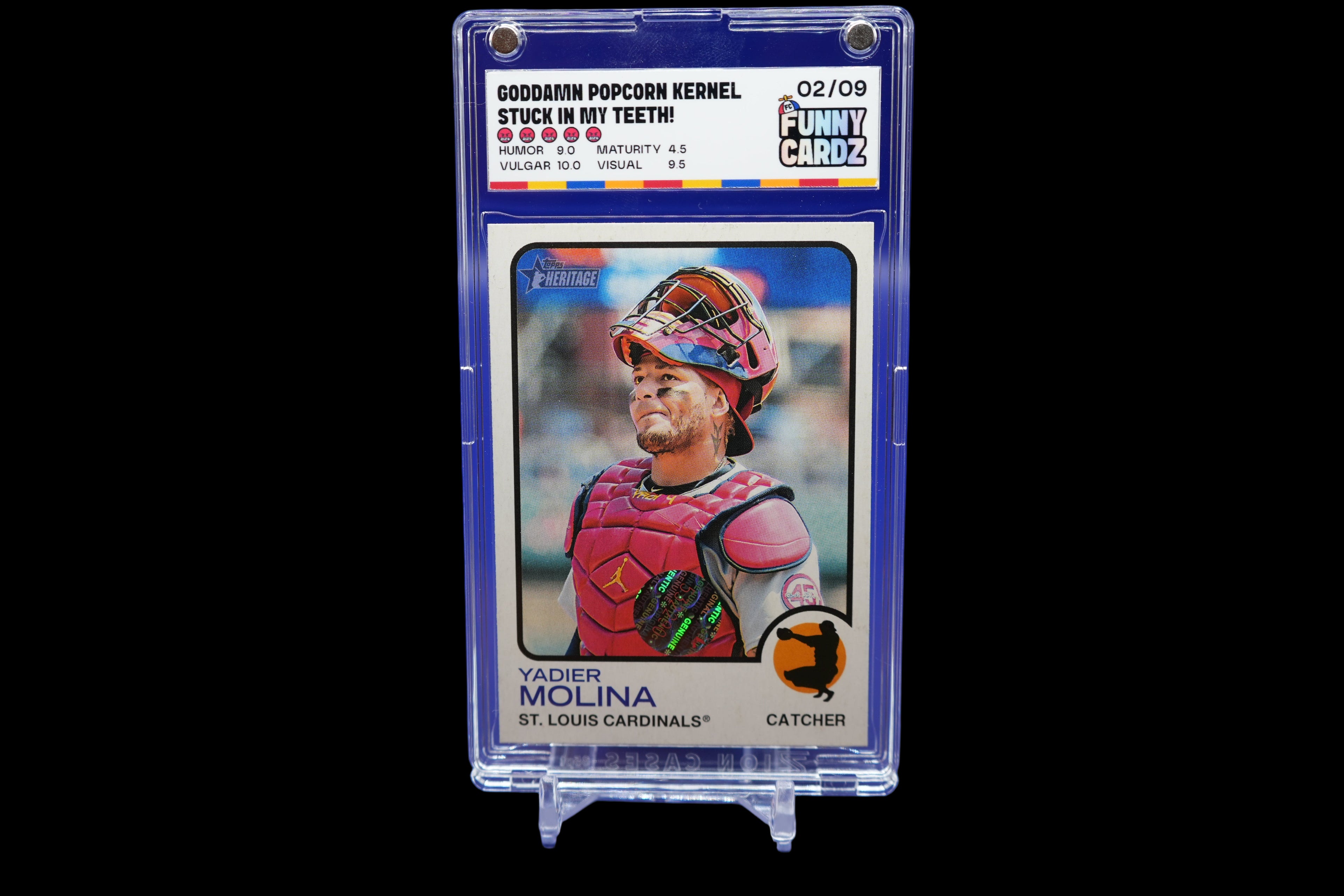 Trading card of a baseball player in a protective case on a blue background