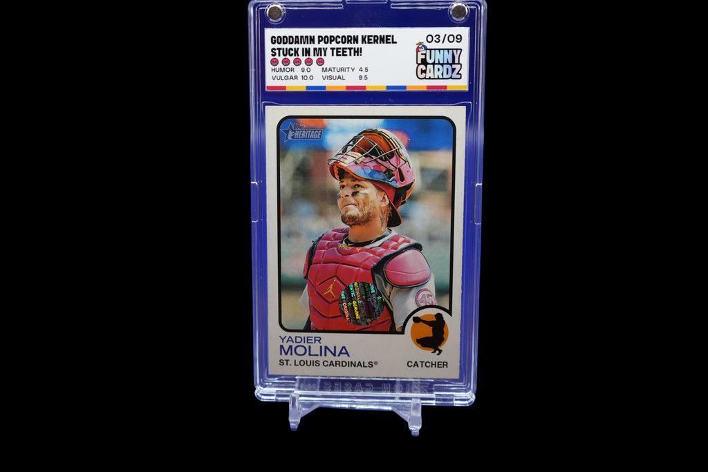 Baseball trading card of Yadier Molina in a protective case on a blue background