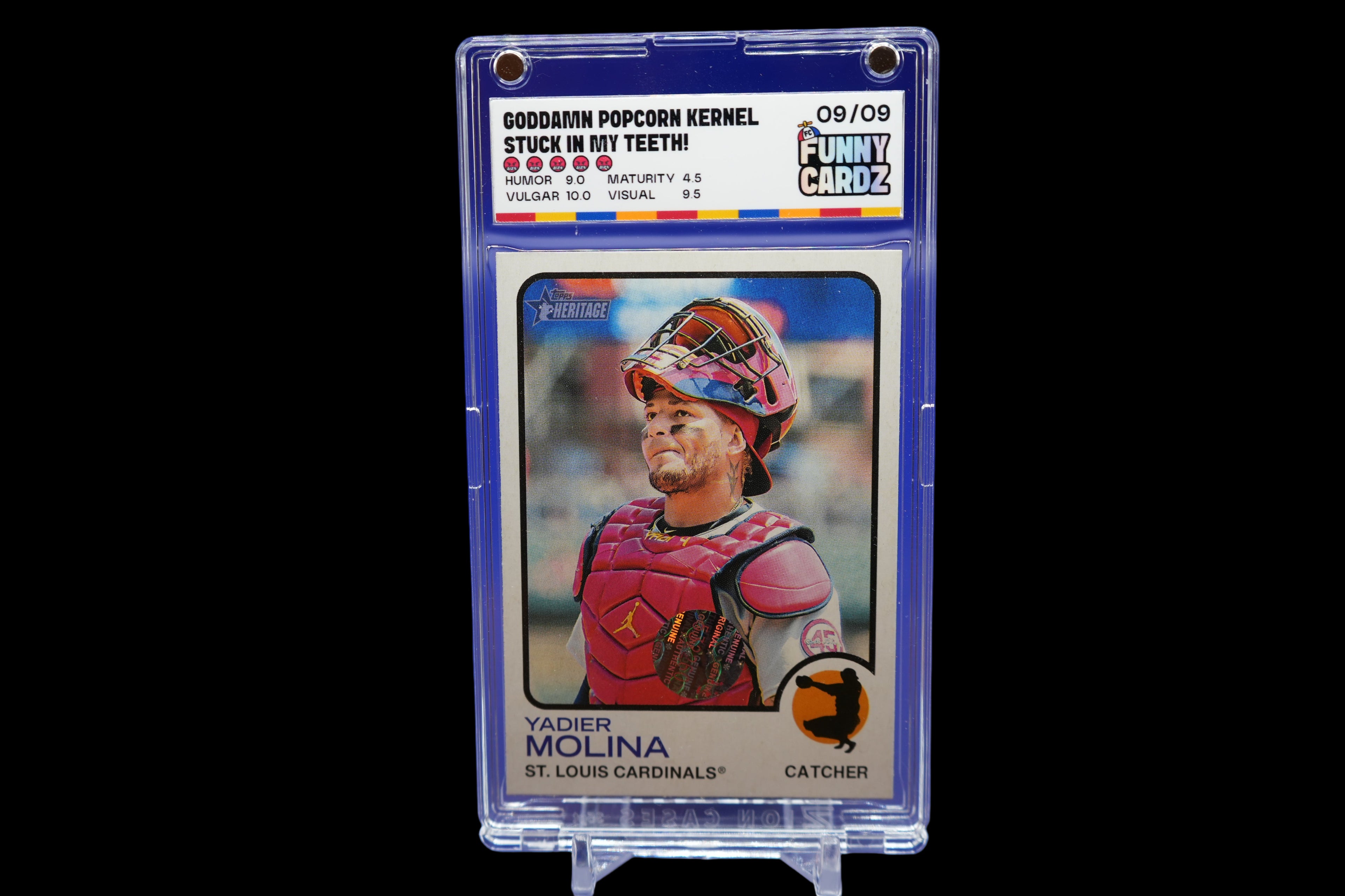 Baseball trading card of Yadier Molina in a protective case on a blue background